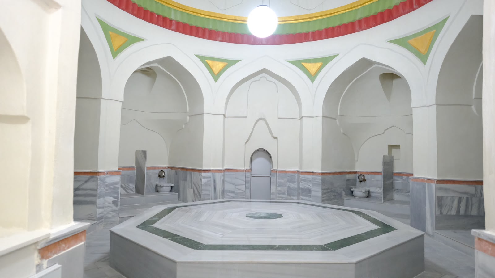 Hızırbey Hamamı interior with traditional marble bathing platform